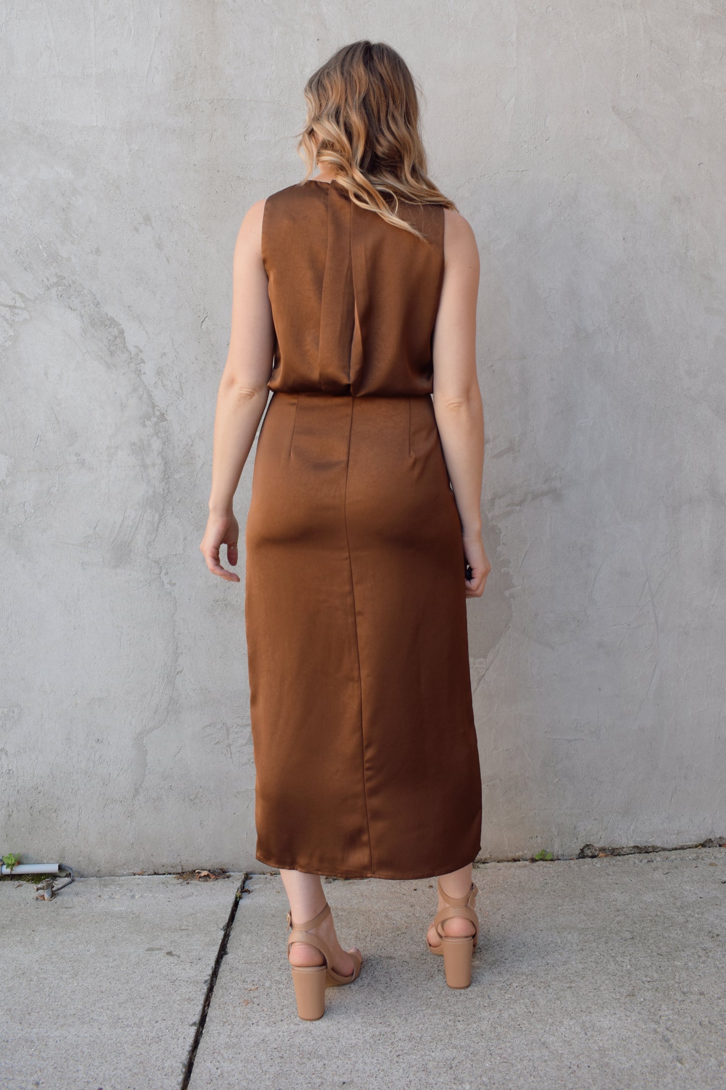 satin bronze midi dress with front side slit fitted waist sleeveless pleated back detail on bodice high neck