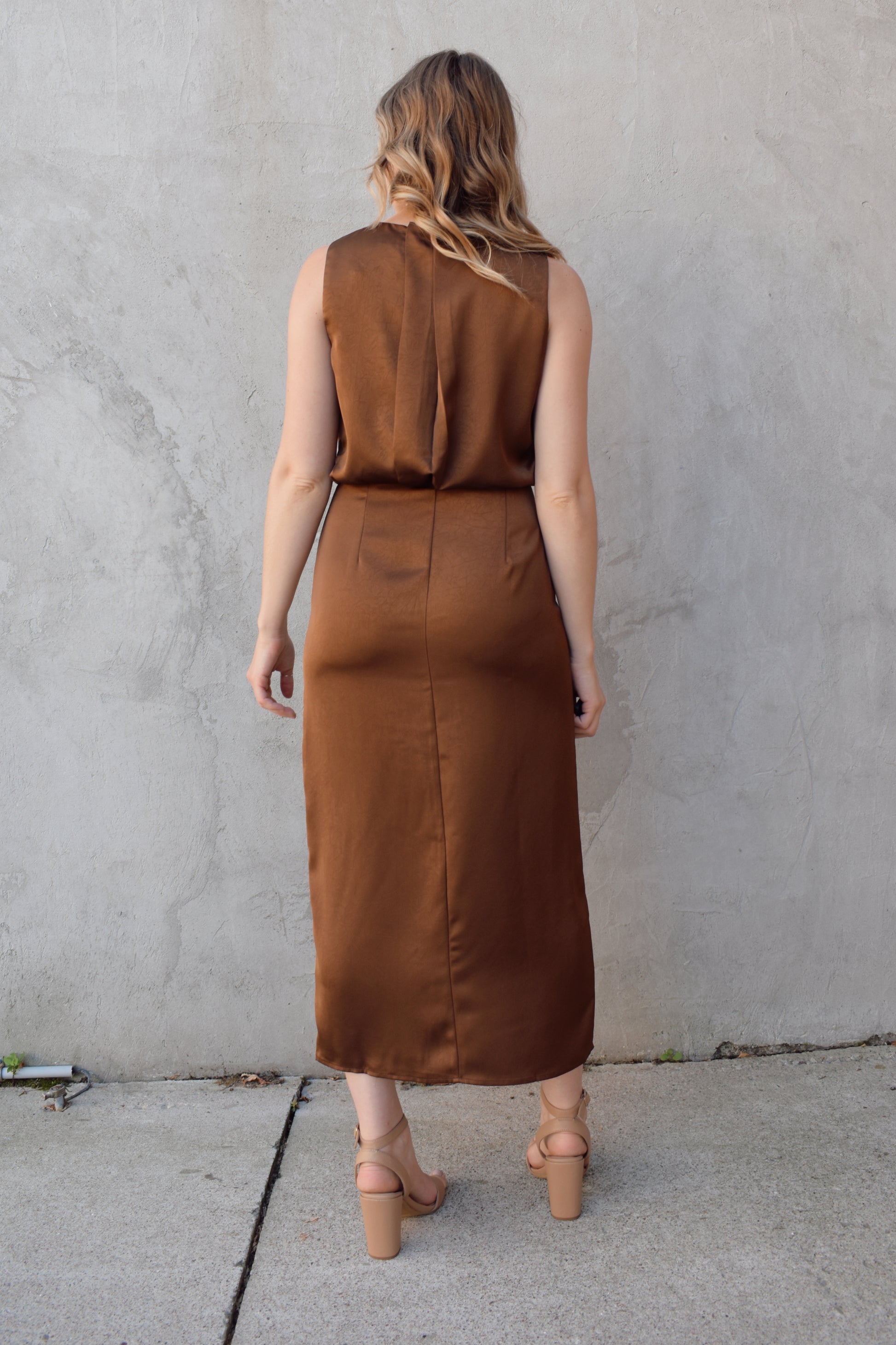 satin bronze midi dress with front side slit fitted waist sleeveless pleated back detail on bodice high neck