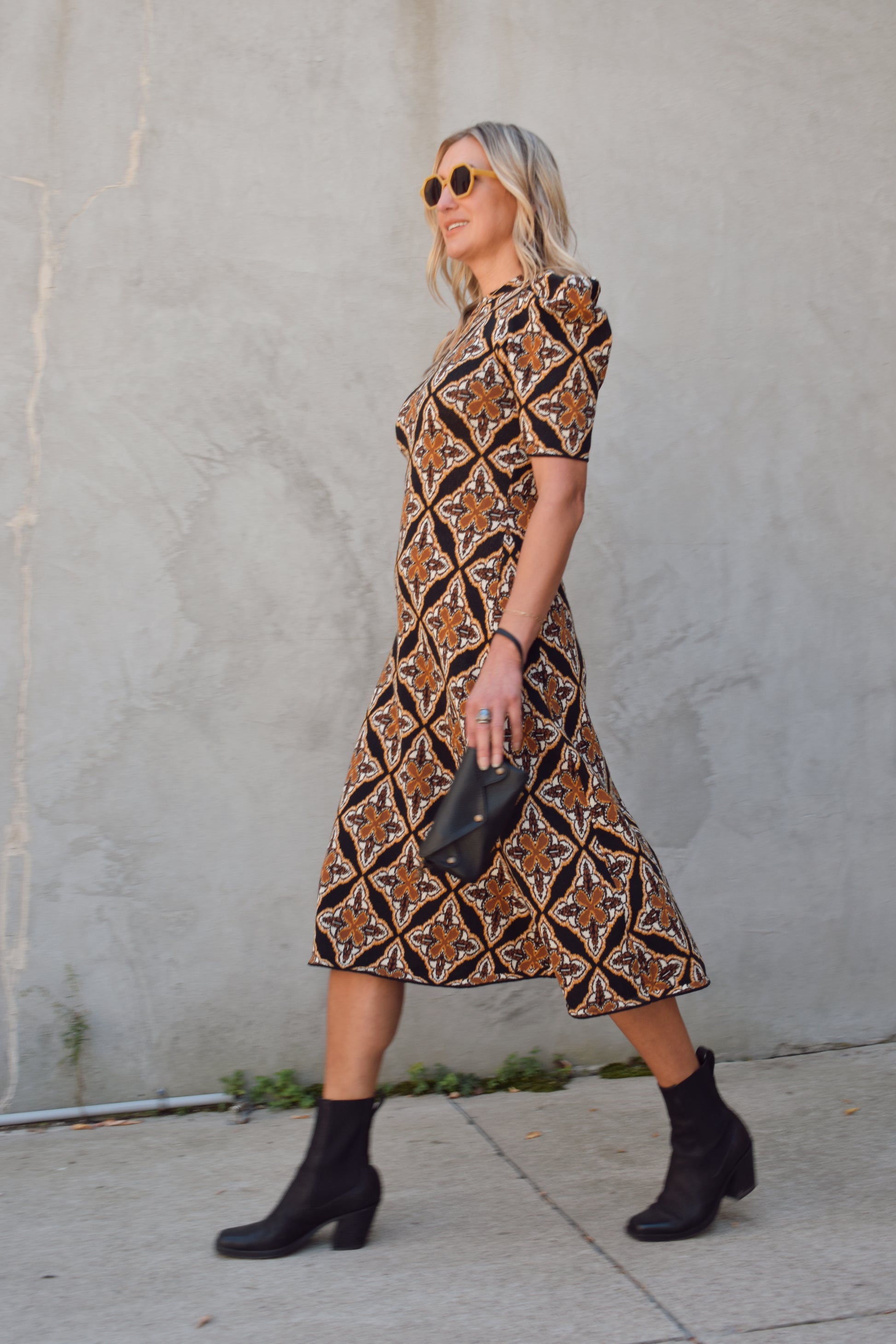 ornamental jacquard sweater midi dress, fitted through bodice and hips, A line skirt, high neck, stretchy, short sleeves that hit at low bicep with puff shoulder structure.