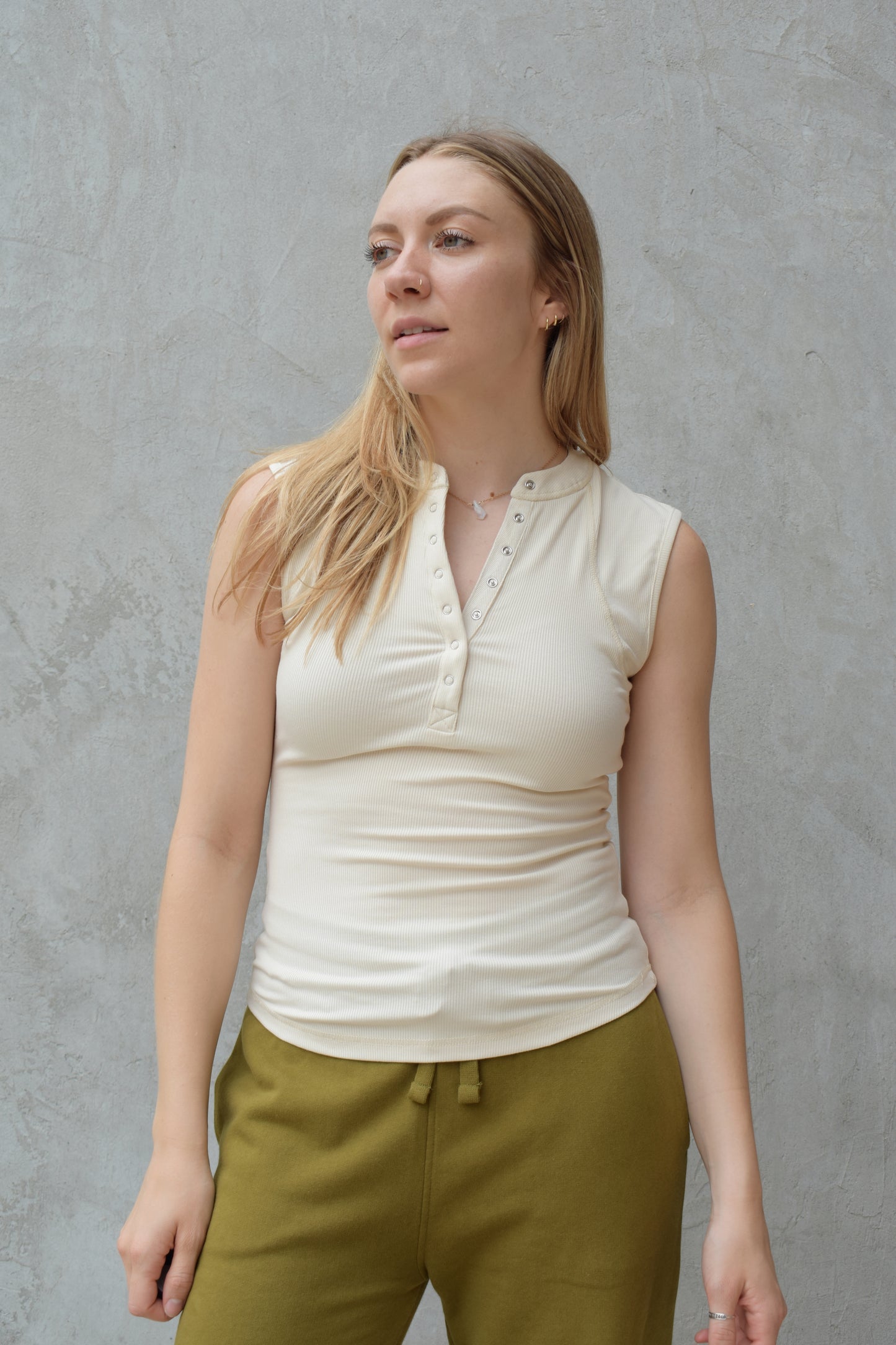 super stretch henley tank top full length with snaps and has exposed seams athleisure fitted