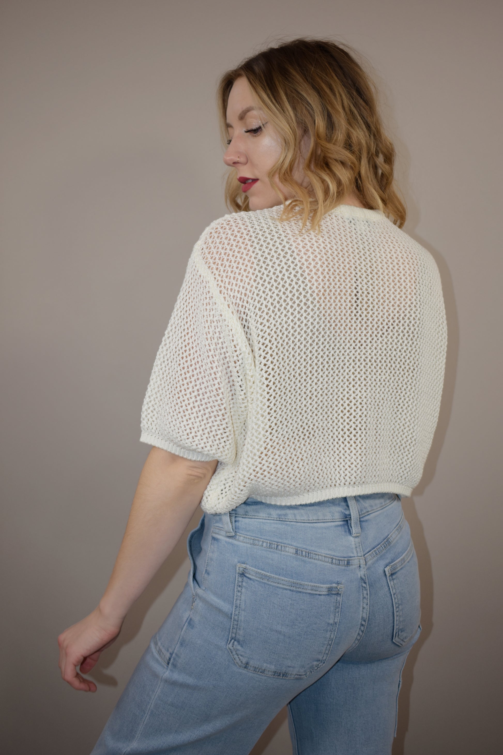 breezy cropped drop shoulder longer short sleeve crocheted shirt with buttons down the front and a crew neck style loose fitting perfect for warm weather