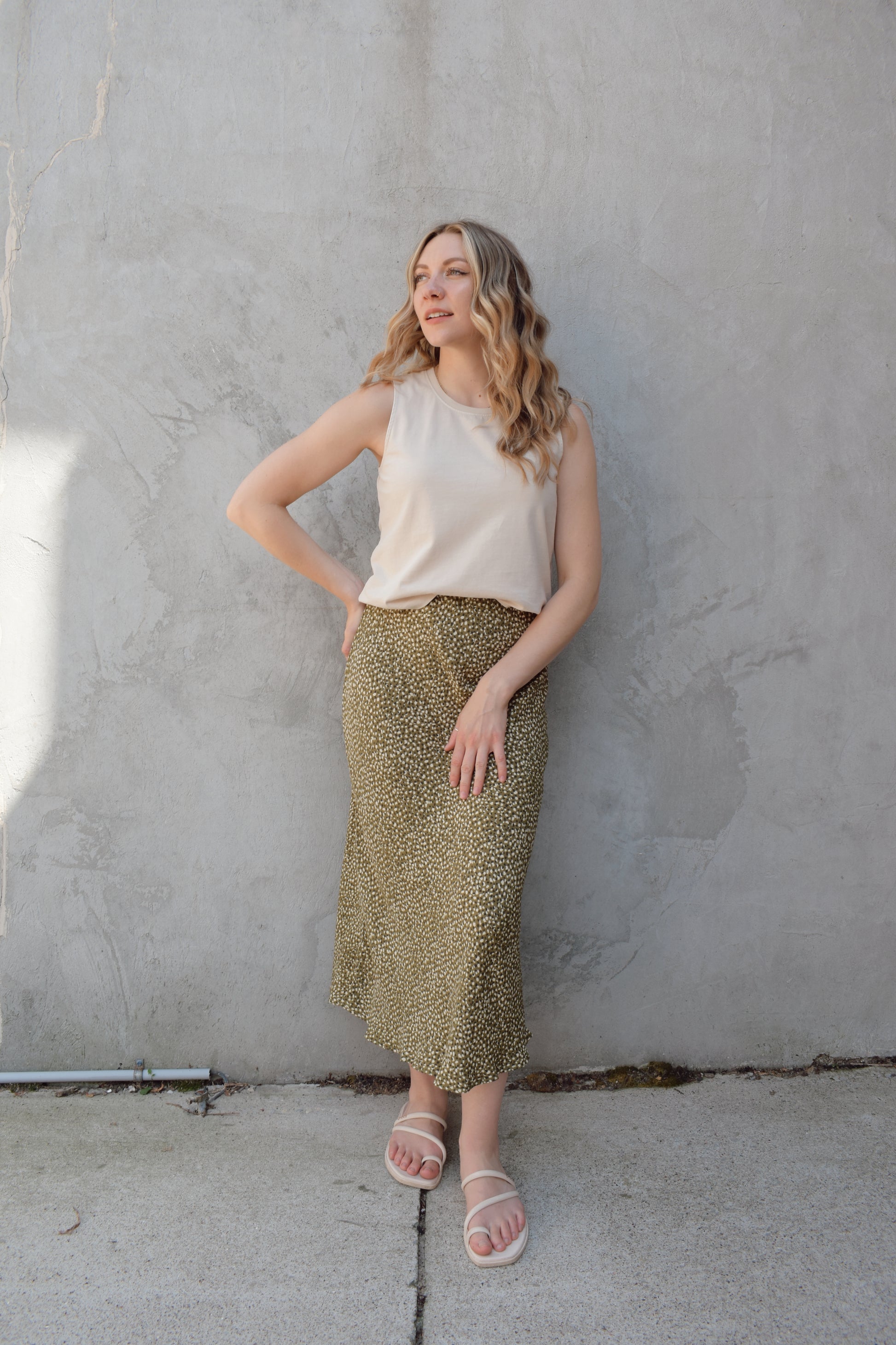 lightweight midi skirt with elastic waistband, no pockets, olive green background with black and cream dotted pattern