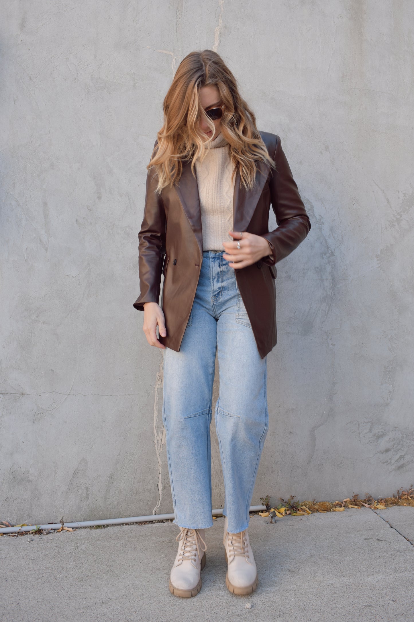 brown faux leather blazer with front flap pockets and front lapel hits at upper thigh split in back hem - fitted