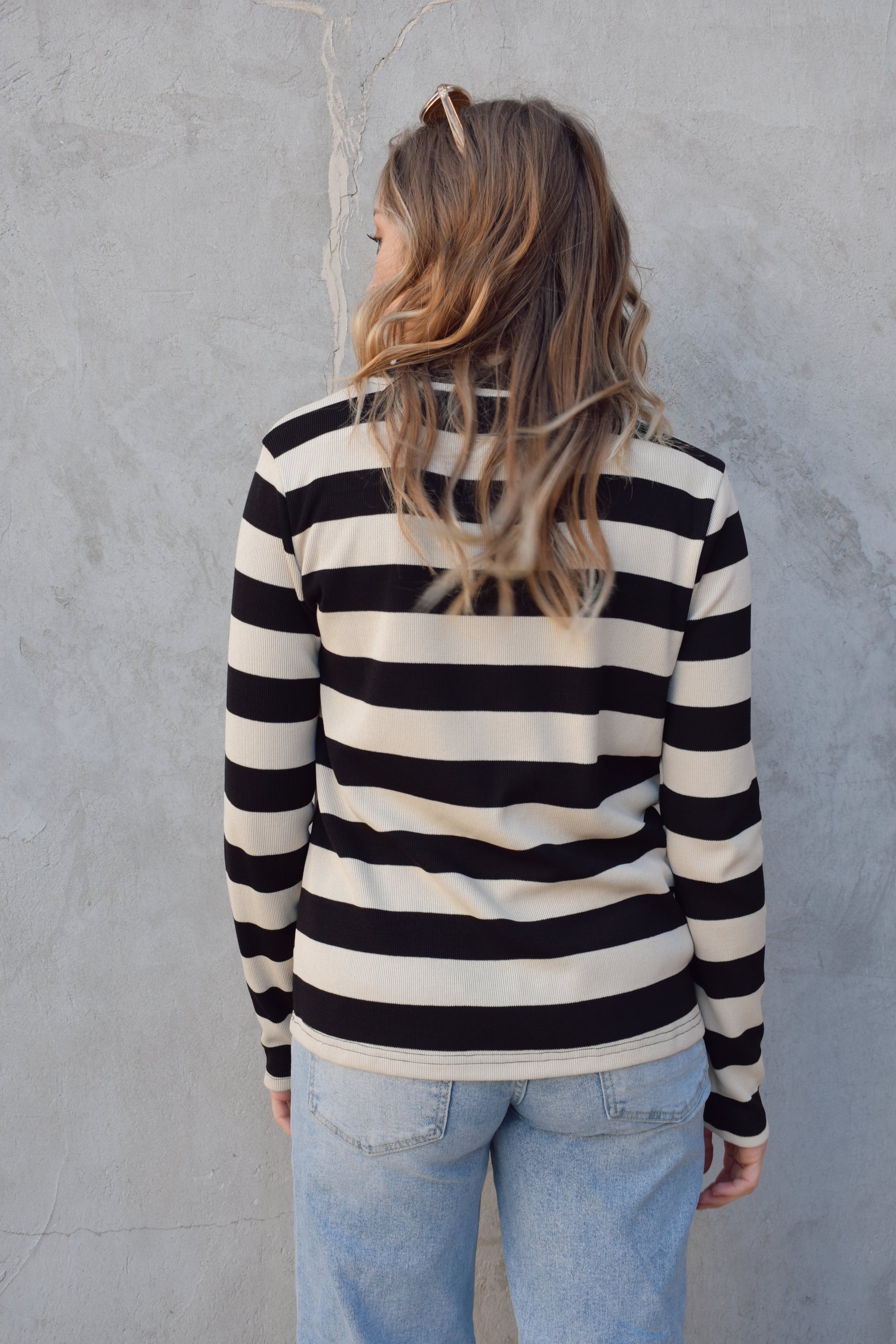 long sleeve full length black and beige striped crew neck. stripes are wide and horizontal. relaxed fit