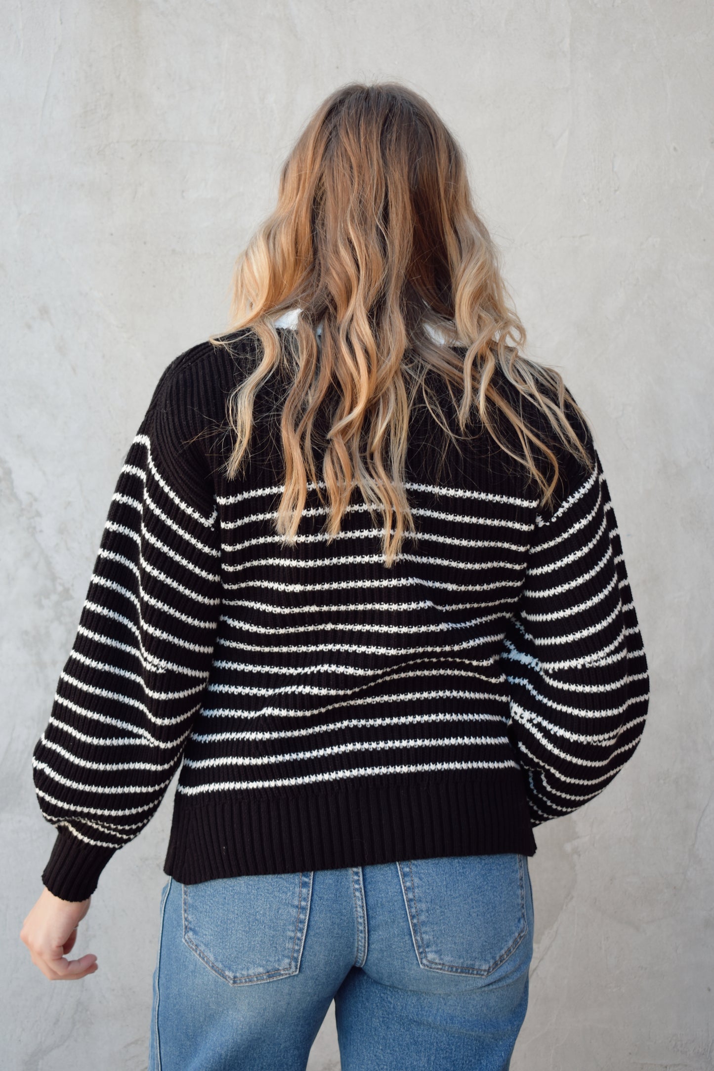 black and white button down cardigan with horizontal stripes drop shoulder balloon sleeves straight fit full length solid white neckline solid black cuffs and hem