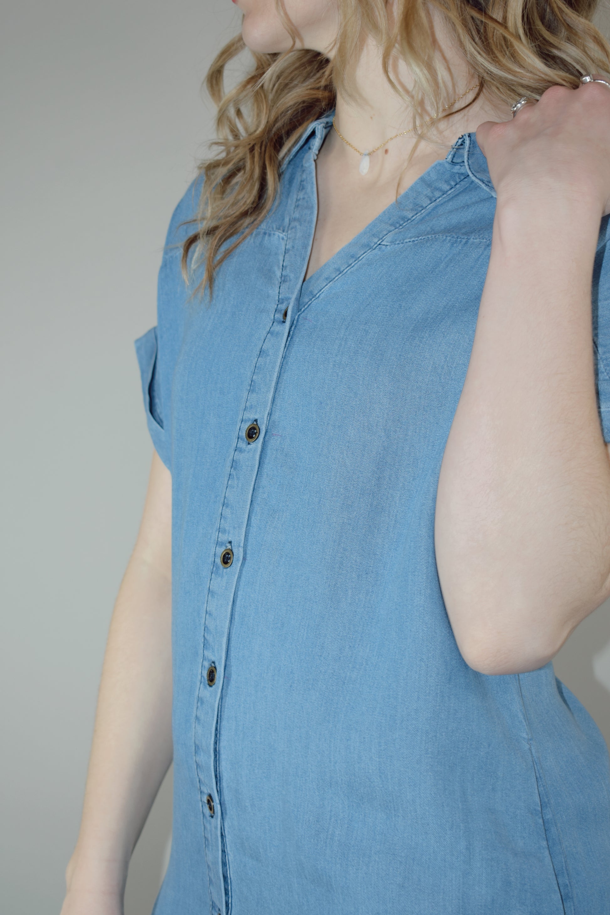 Tencel medium wash denim button down collared t shirt midi dress with side slits, side pockets, cuffed short sleeves