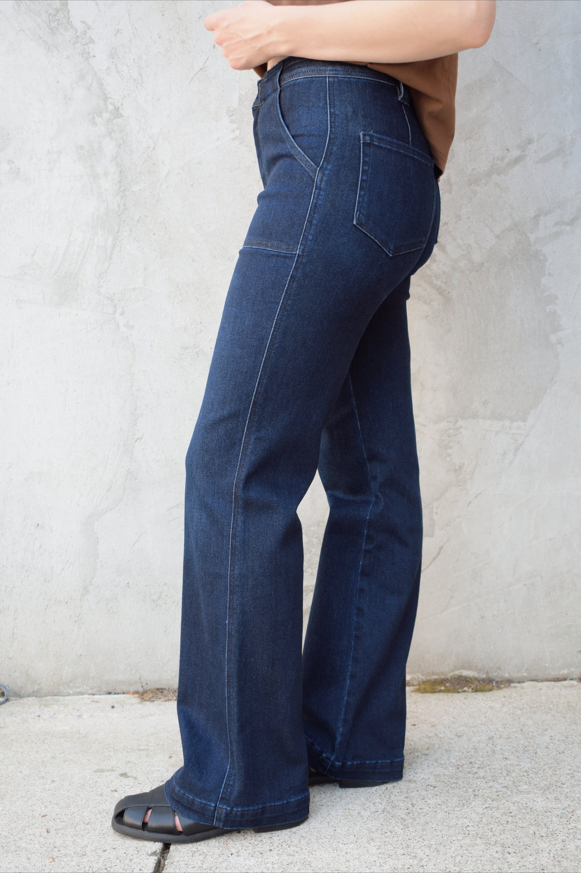 high rise dark wash full length jeans stretch denim patch style oversized front pockets no holes polished look