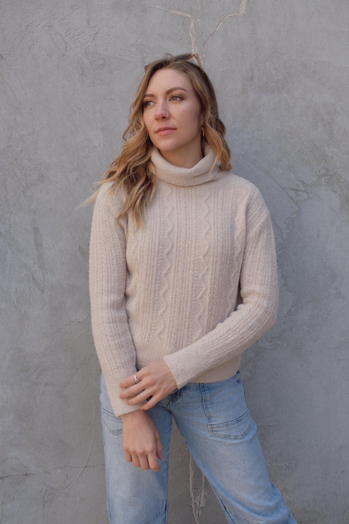 cable knit turtleneck sweater full length relaxed fit neck folds over drop shoulders
