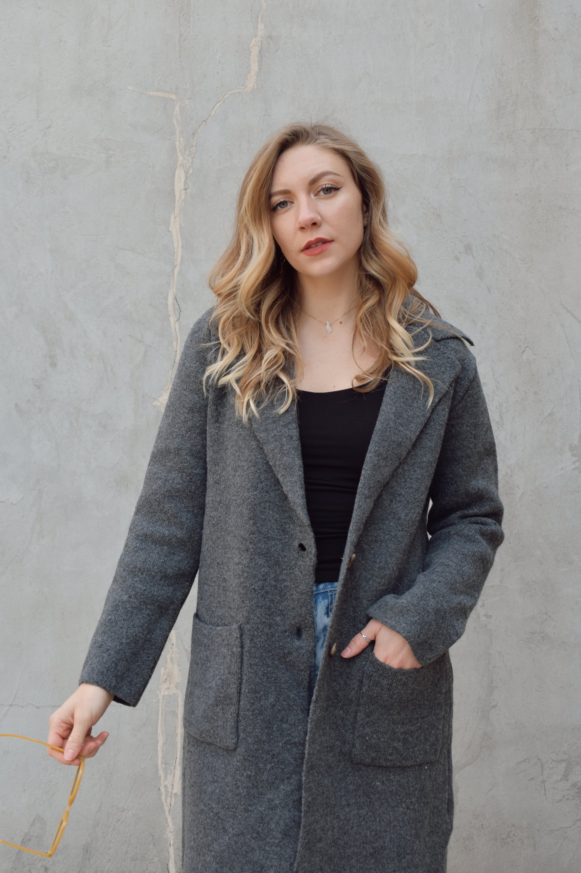 pea coat style cardigan with notched collar two button enclosure front patch pockets, hits above the knee.