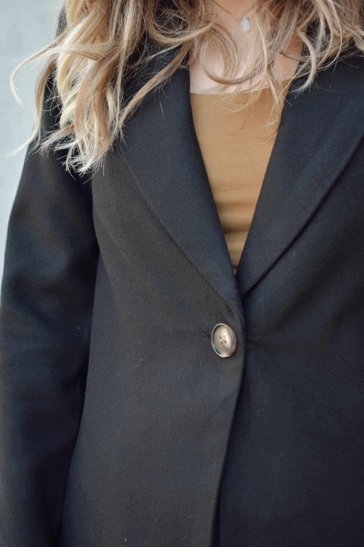 single button over coat peacoat thick felt fabric - fitted style hits mid thigh, side pockets, notched collar.