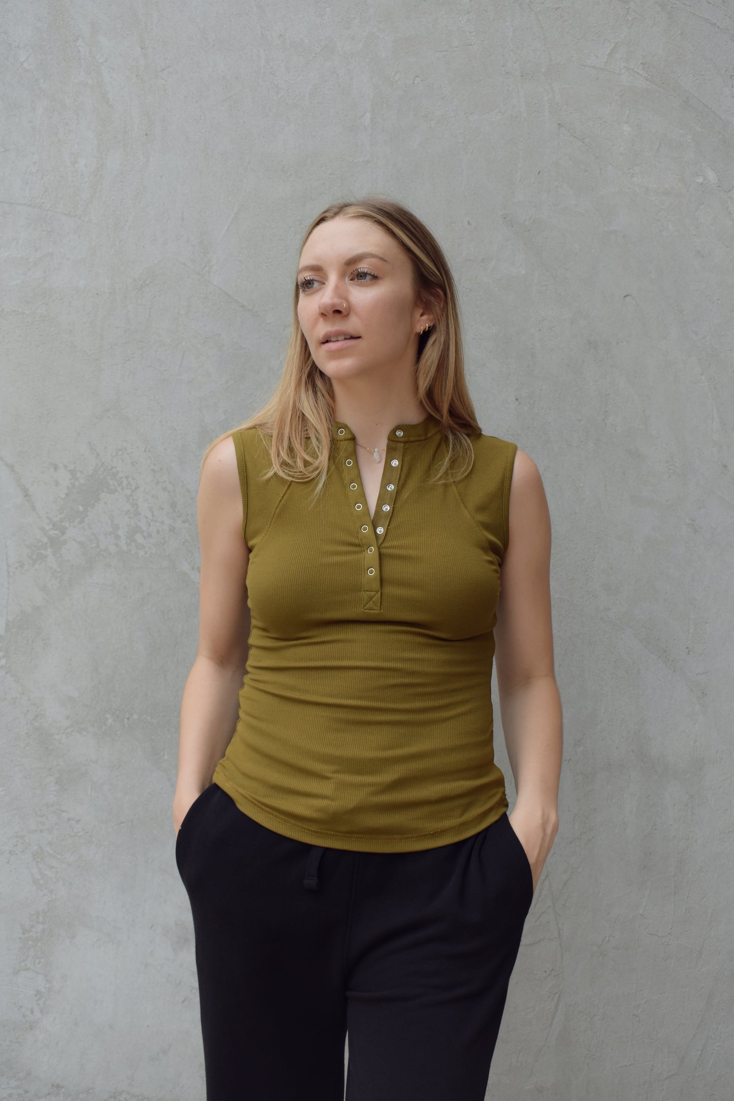 super stretch henley tank top full length with snaps and has exposed seams athleisure fitted