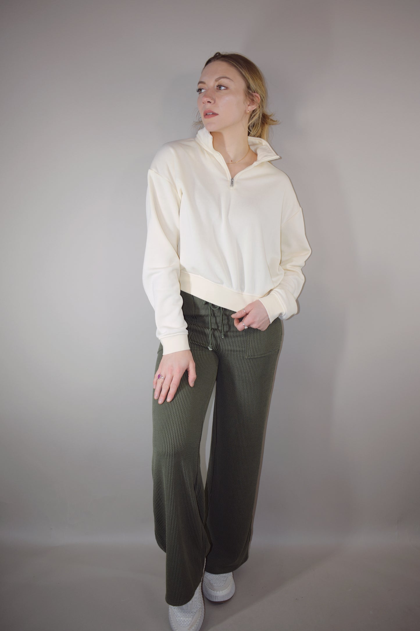 full length high waisted wide leg ribbed olive green athleisure pants with elastic waistband, drawstring, and front pockets.