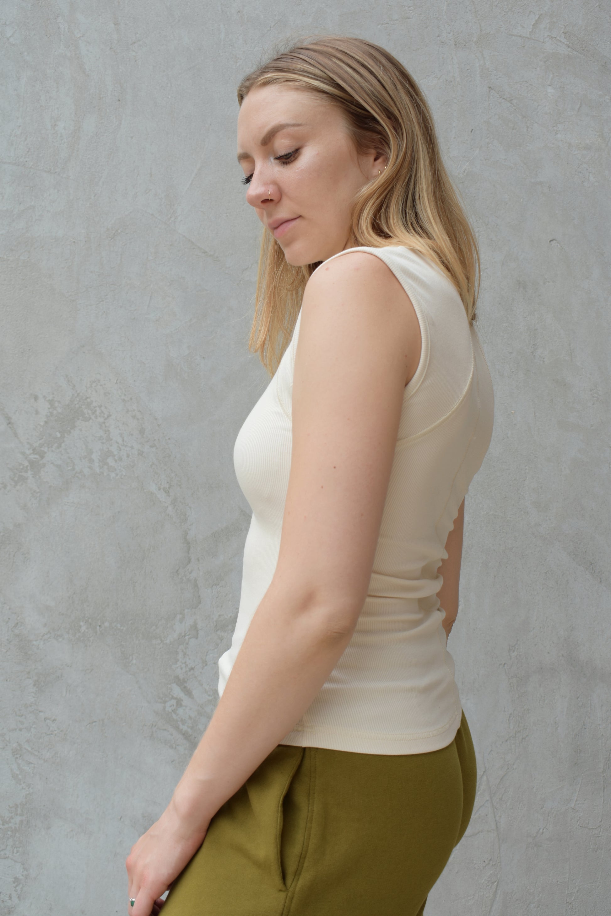 super stretch henley tank top full length with snaps and has exposed seams athleisure fitted
