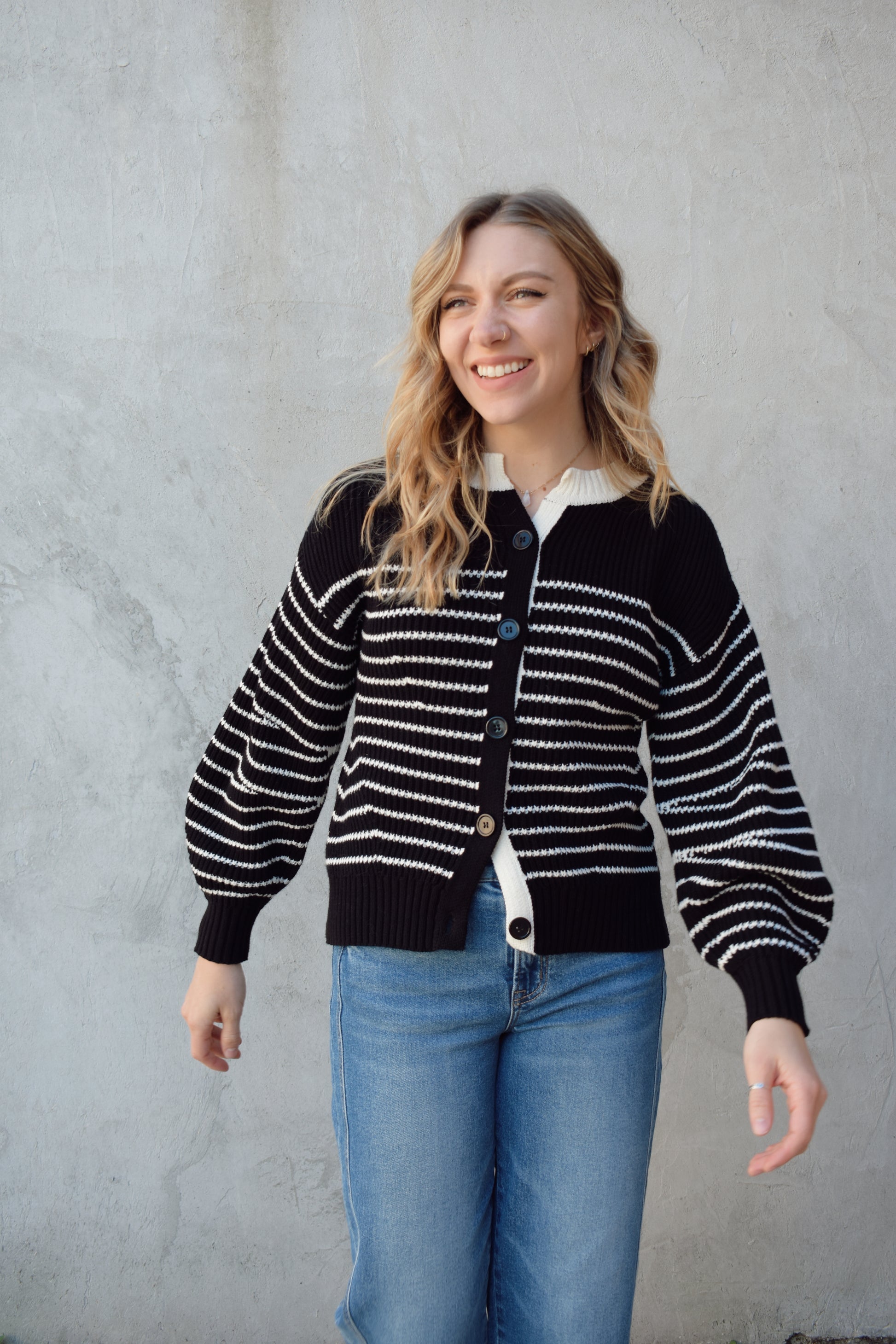 black and white button down cardigan with horizontal stripes drop shoulder balloon sleeves straight fit full length solid white neckline solid black cuffs and hem