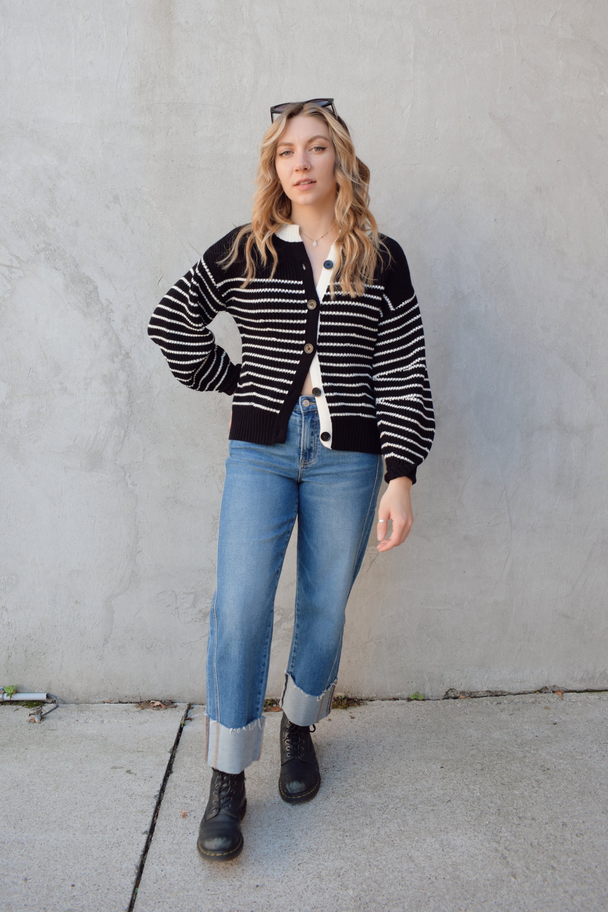 black and white button down cardigan with horizontal stripes drop shoulder balloon sleeves straight fit full length solid white neckline solid black cuffs and hem