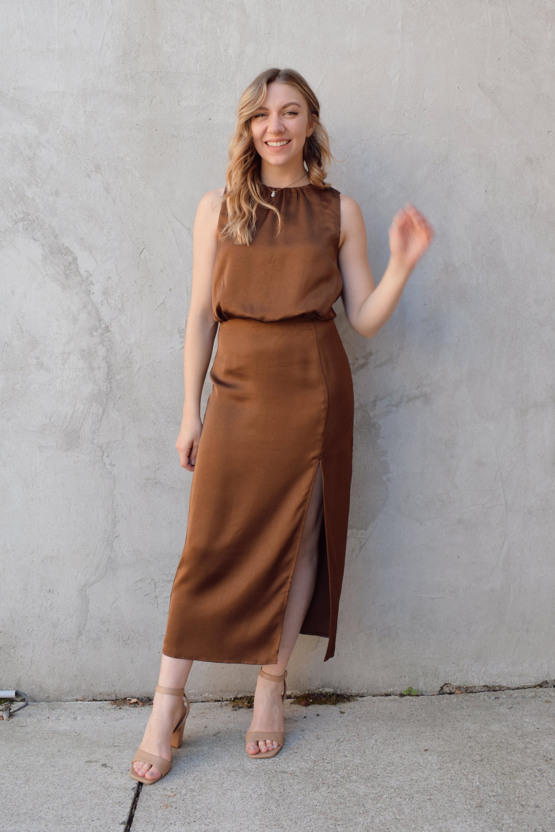 satin bronze midi dress with front side slit fitted waist sleeveless pleated back detail on bodice high neck