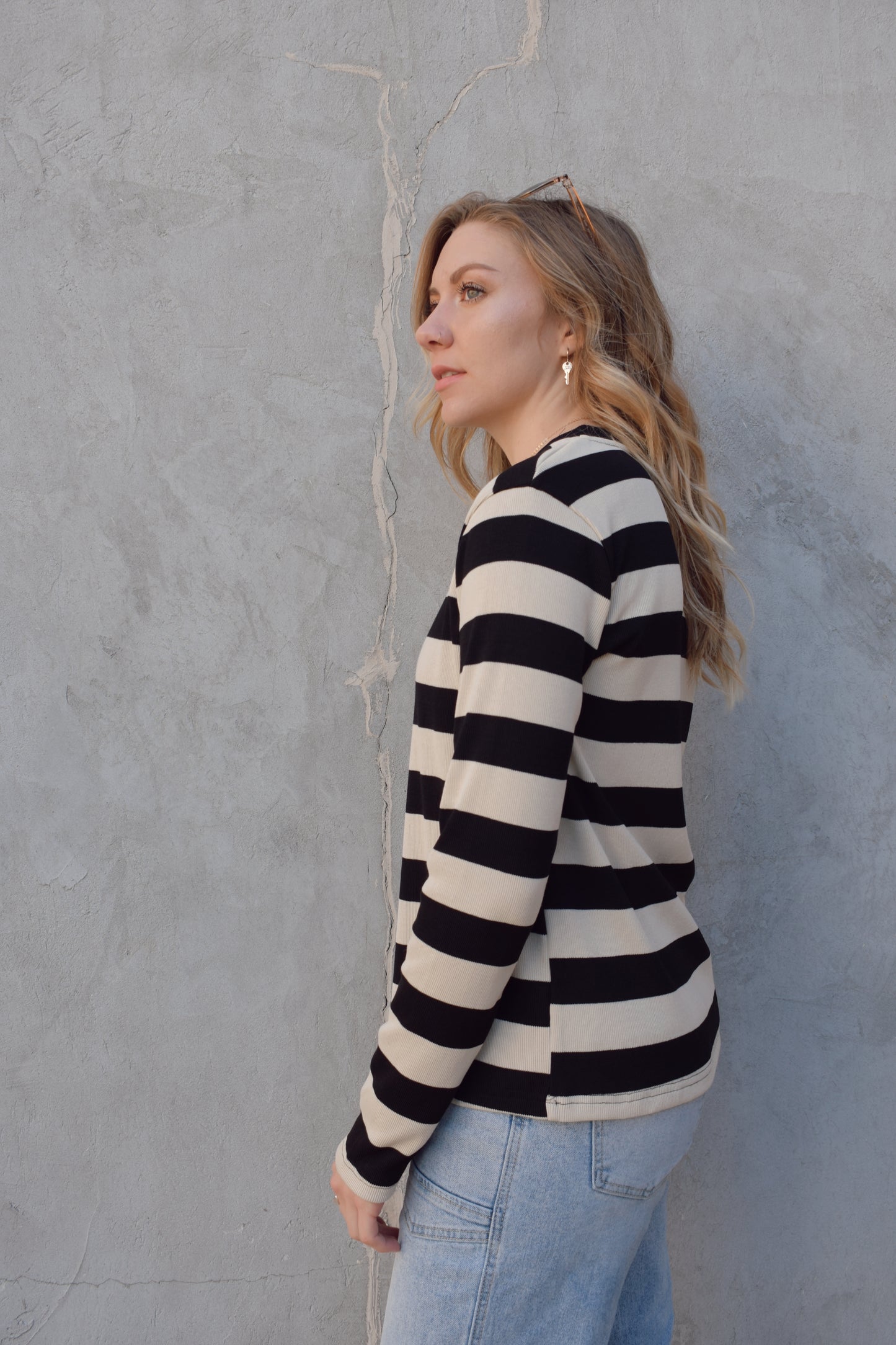 long sleeve full length black and beige striped crew neck. stripes are wide and horizontal. relaxed fit