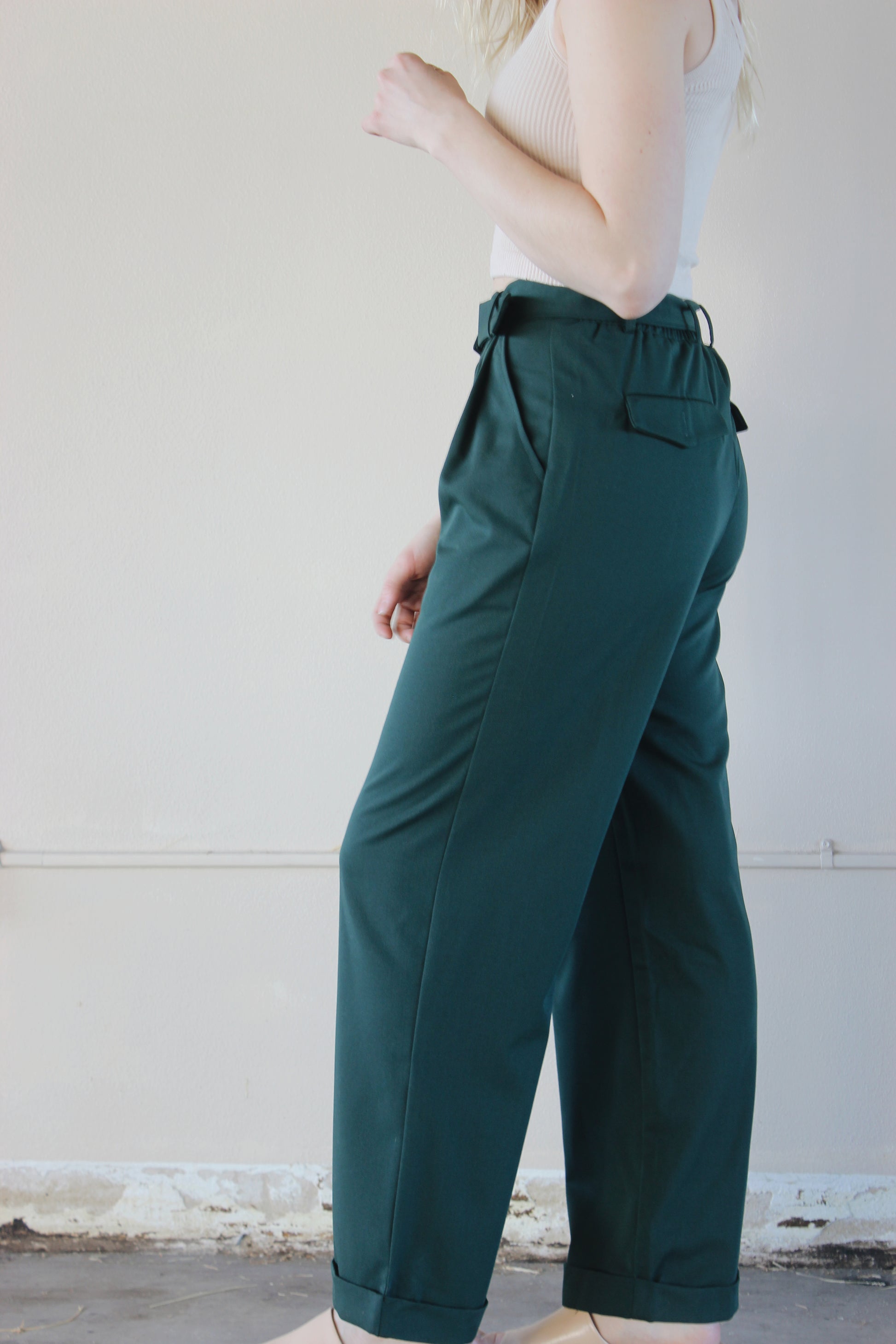 straight leg belted trousers with cuffed hem, front pockets with front pleats, back pockets with flap and button enclosure