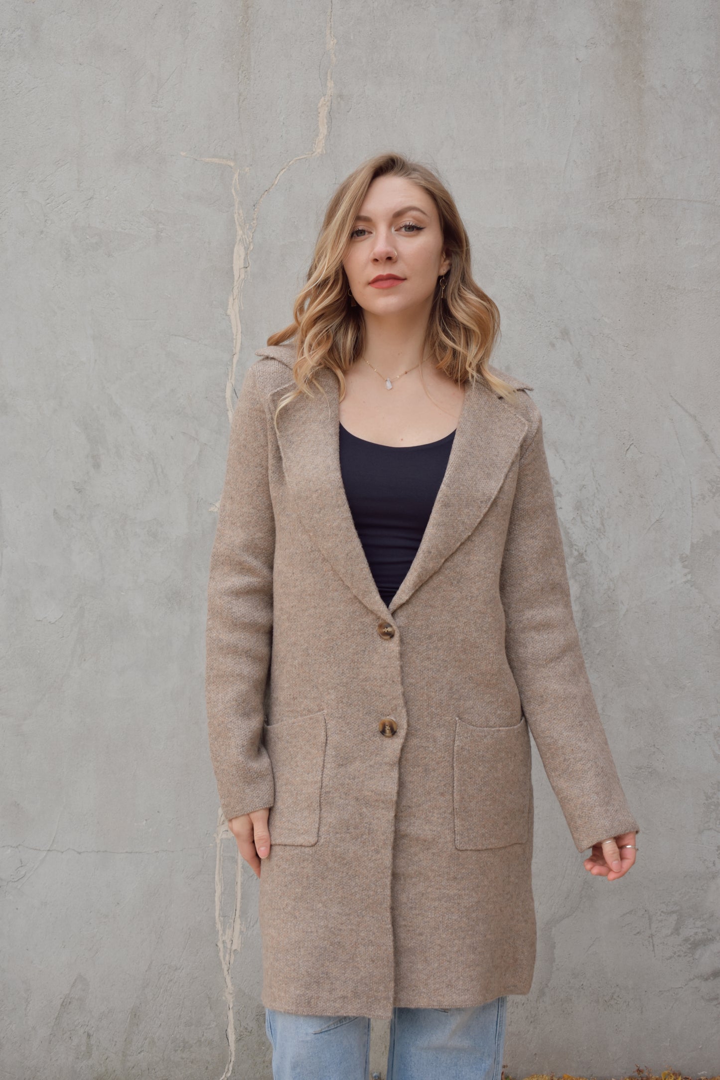 pea coat style cardigan with notched collar two button enclosure front patch pockets, hits above the knee.