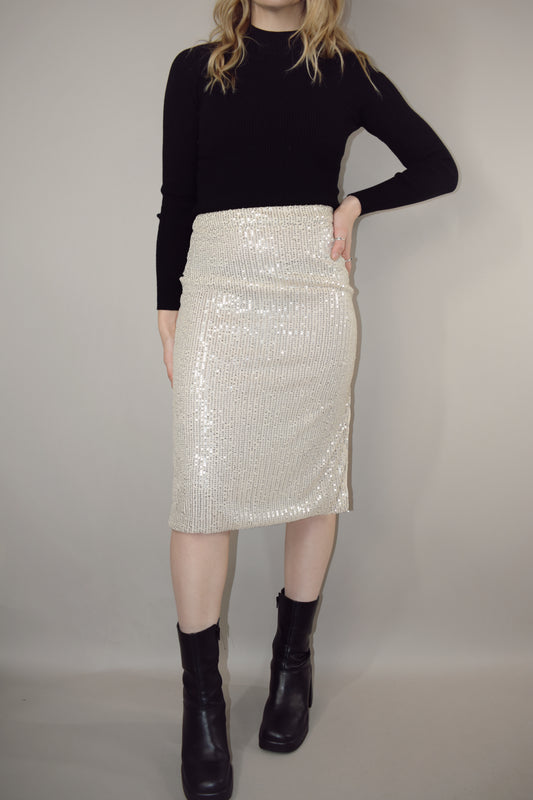 ivory sequin midi pencil skirt with side slit and side zip enclosure hits just below the knee