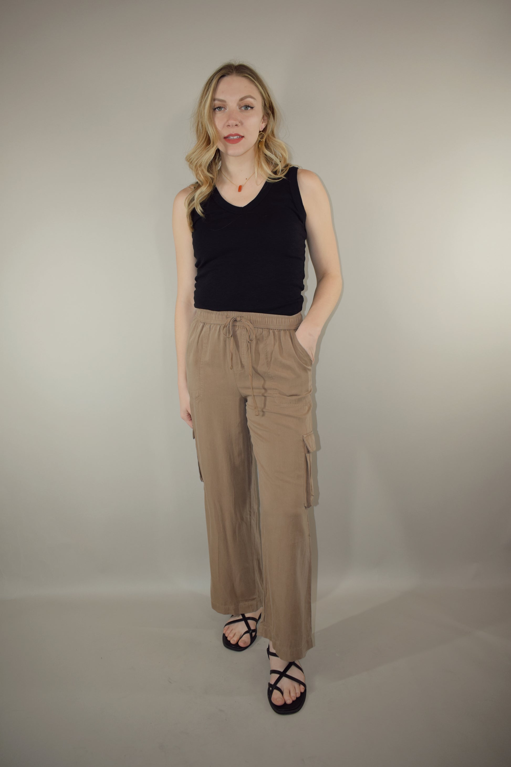 tencel cargo pants with slight wide leg elastic waistband with drawstring side pockets and side cargo pockets patch back pockets