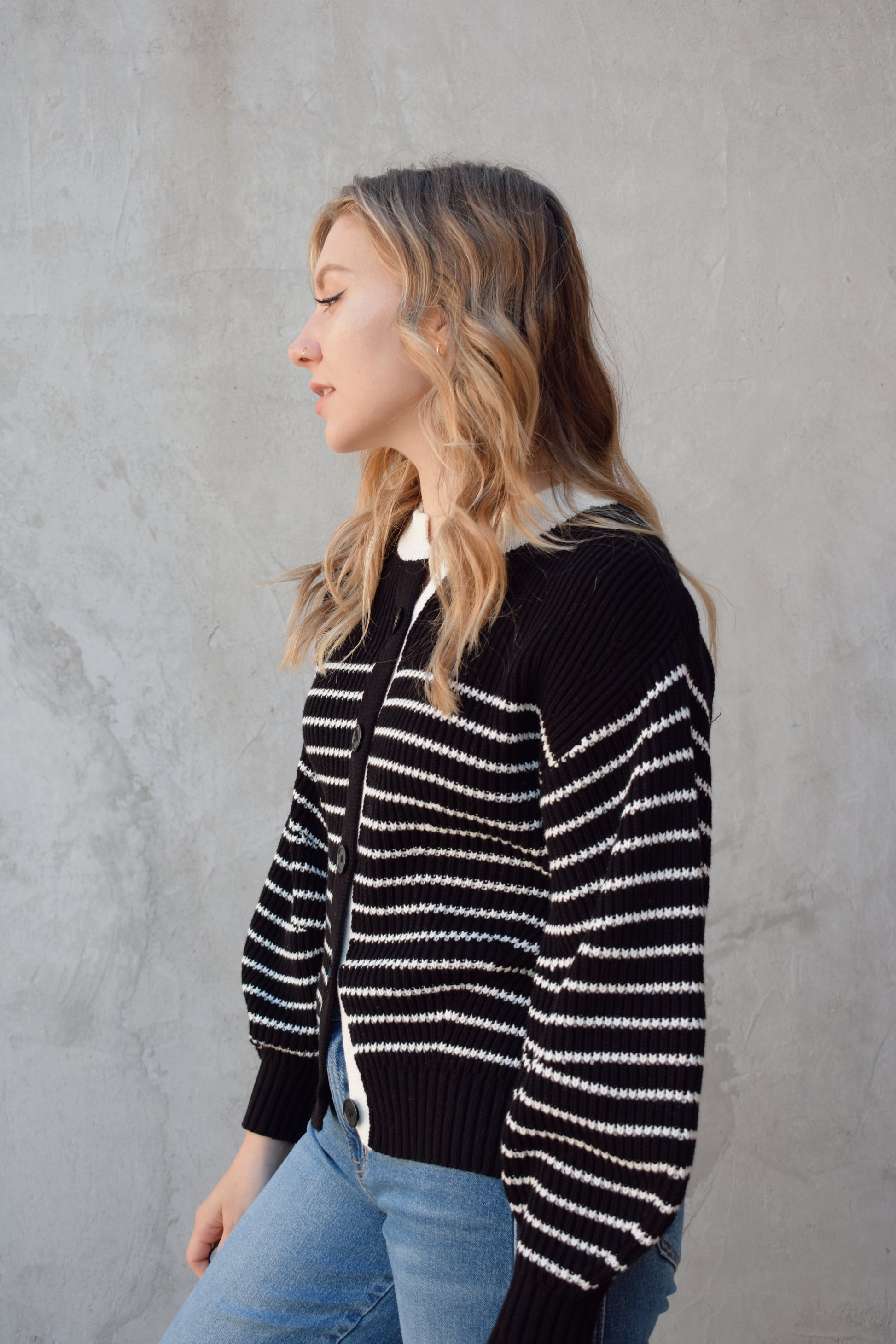 black and white button down cardigan with horizontal stripes drop shoulder balloon sleeves straight fit full length solid white neckline solid black cuffs and hem