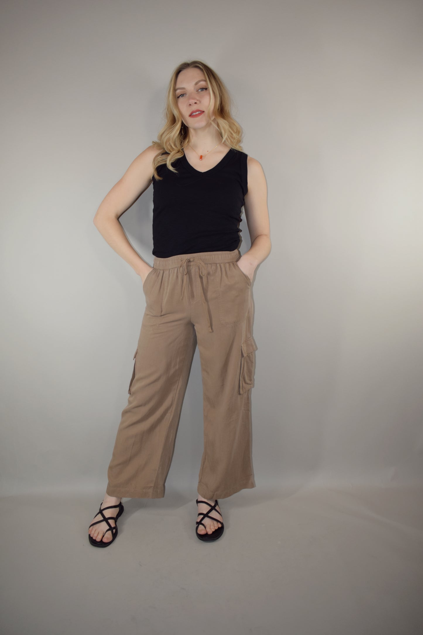 tencel cargo pants with slight wide leg elastic waistband with drawstring side pockets and side cargo pockets patch back pockets