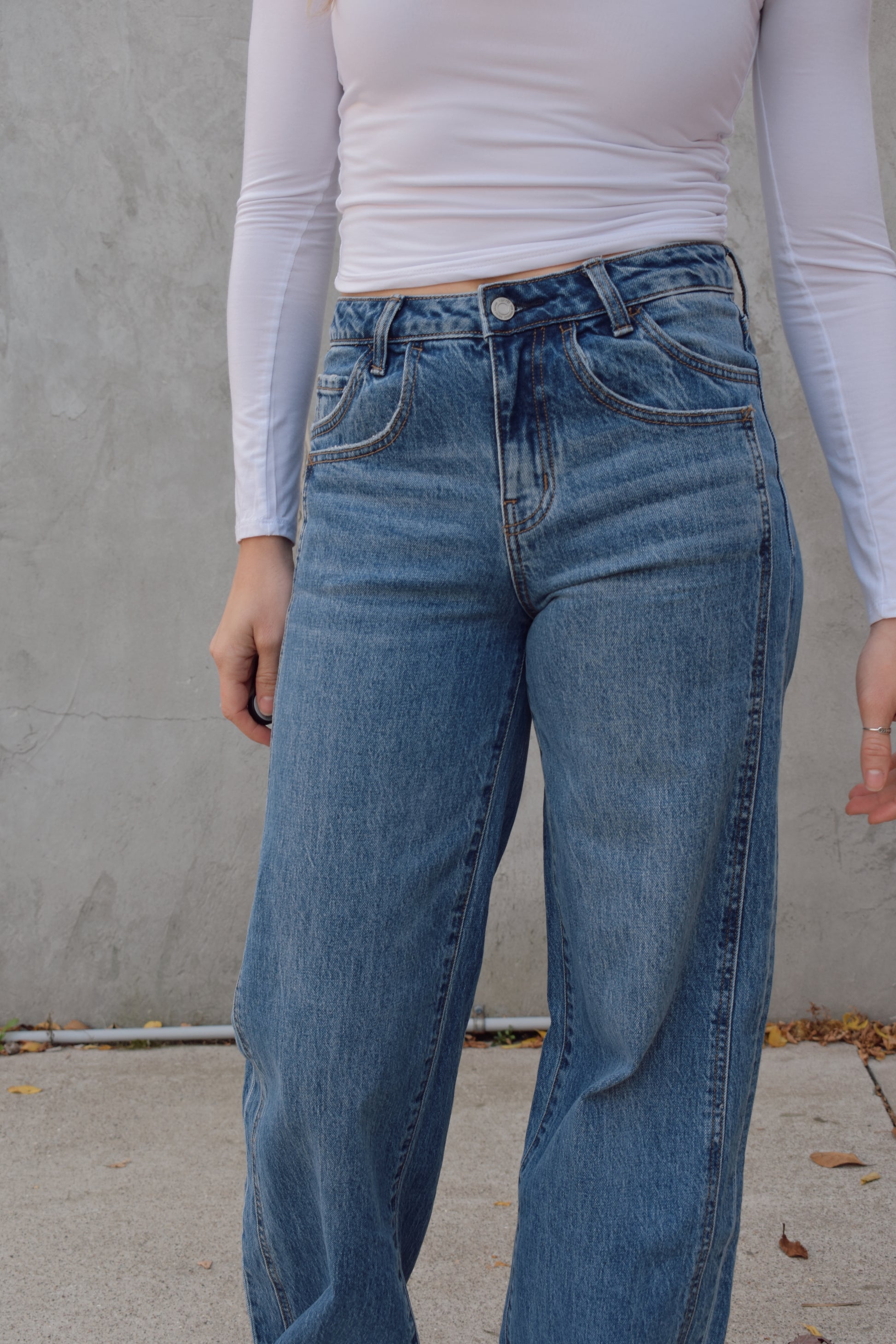 Long wide leg double panel double front pocket jeans with wide cuff at hem that is able to be uncuffed too. no distressing or holes, waistband is a little more rigid but denim is stretchy. zip and button enclosure, has beltloops 