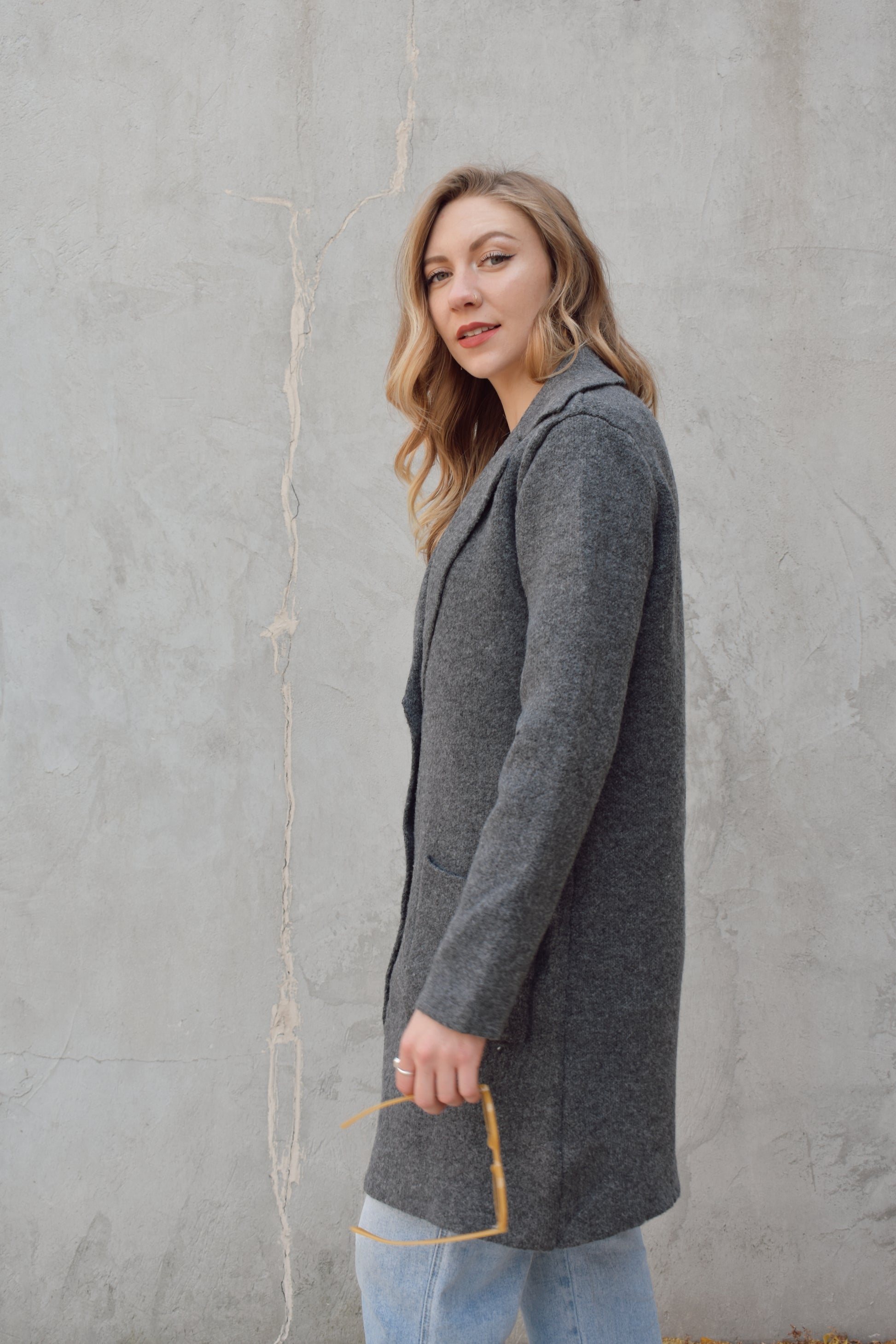 pea coat style cardigan with notched collar two button enclosure front patch pockets, hits above the knee.