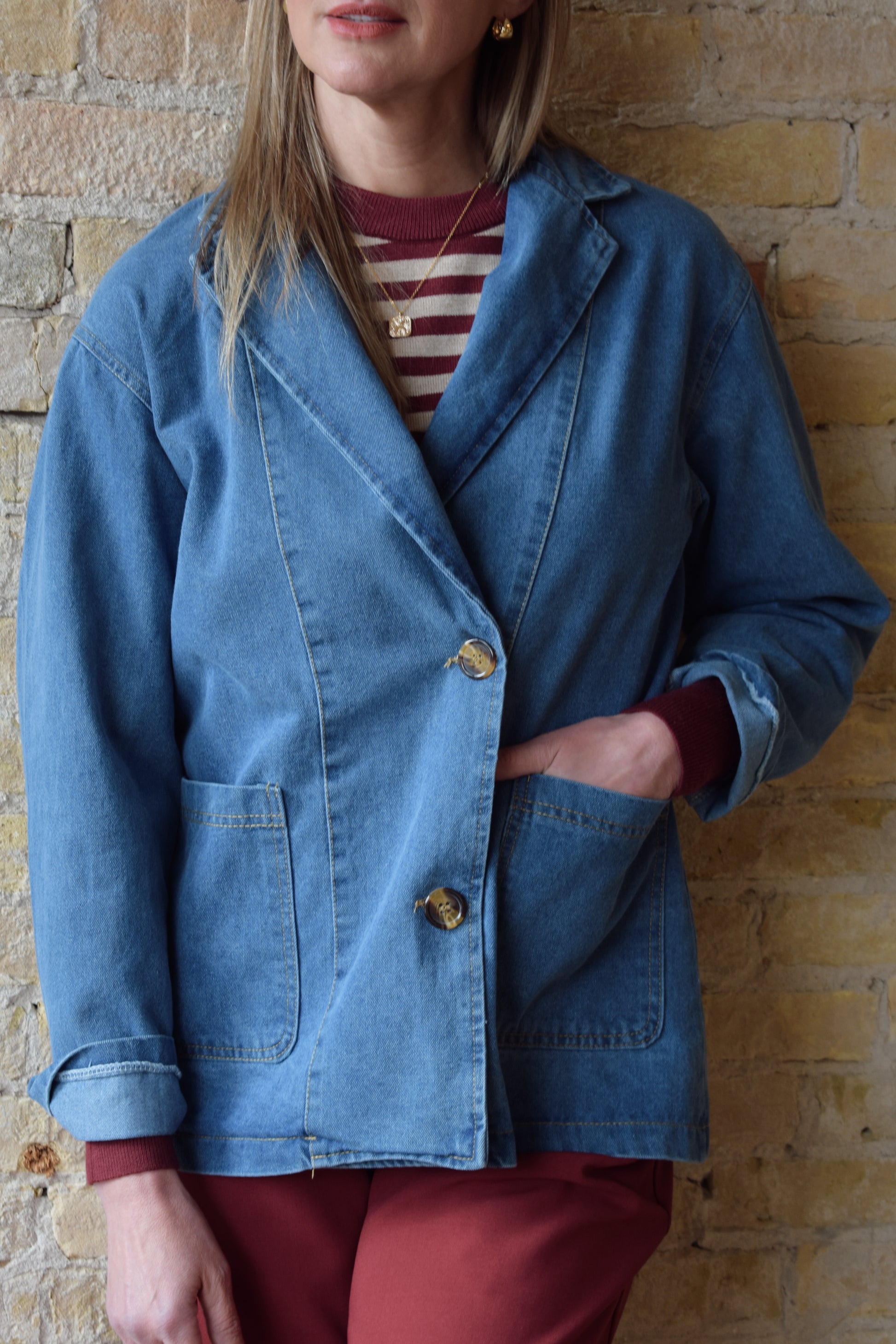 medium/light wash denim blazer jacket with front patch pockets and two button enclosure relaxed fit full length