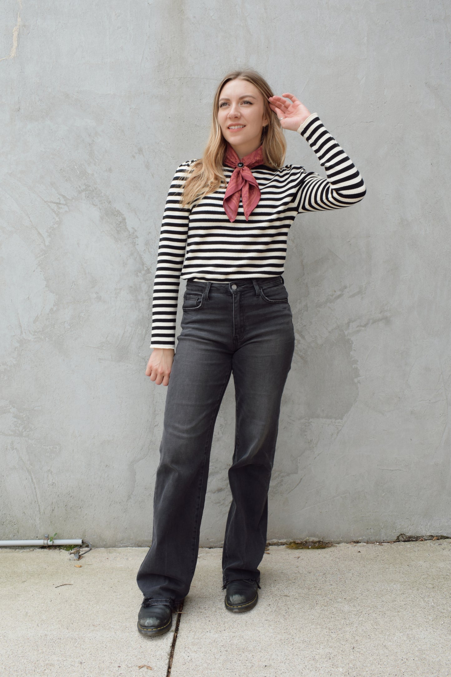 high rise washed black wide leg flare jeans full length stretch denim distressed hem but no holes zip and button enclosure has beltloops has front and back pockets 