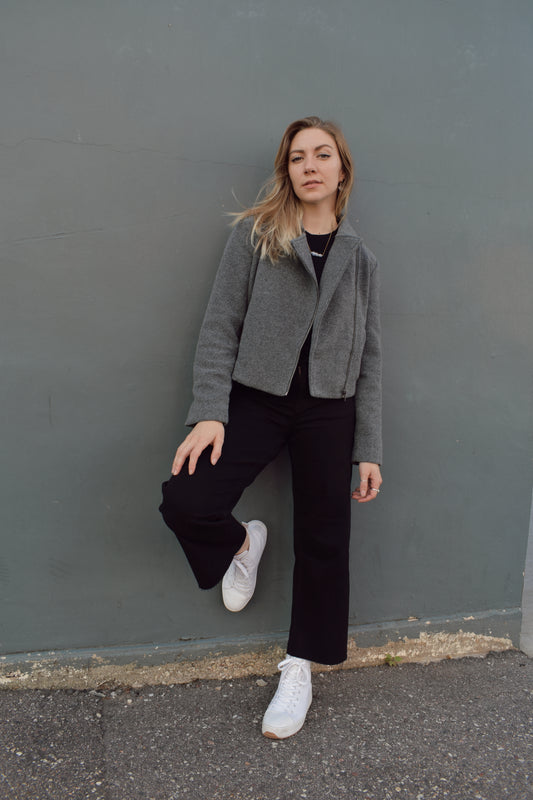 slightly cropped grey moto jacket with notched collar and zip enclosure and has pockets