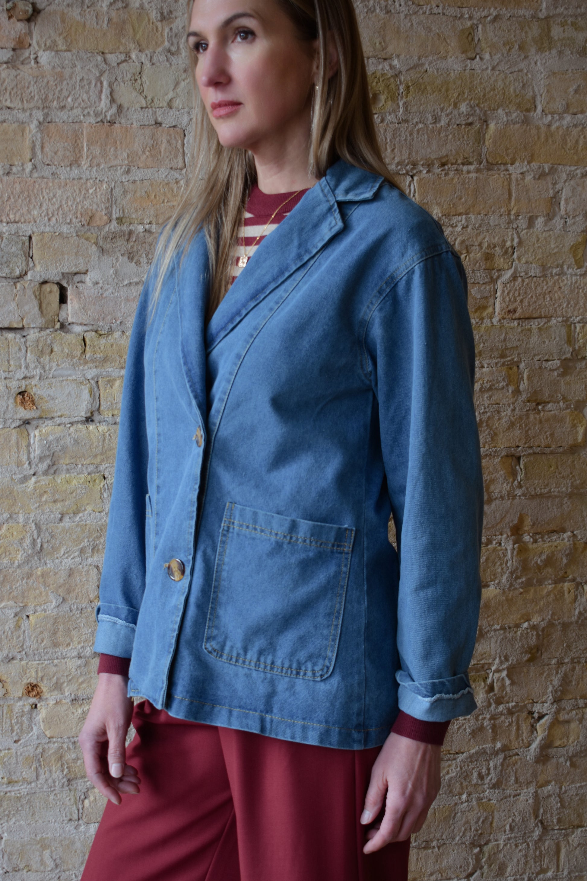 medium/light wash denim blazer jacket with front patch pockets and two button enclosure relaxed fit full length