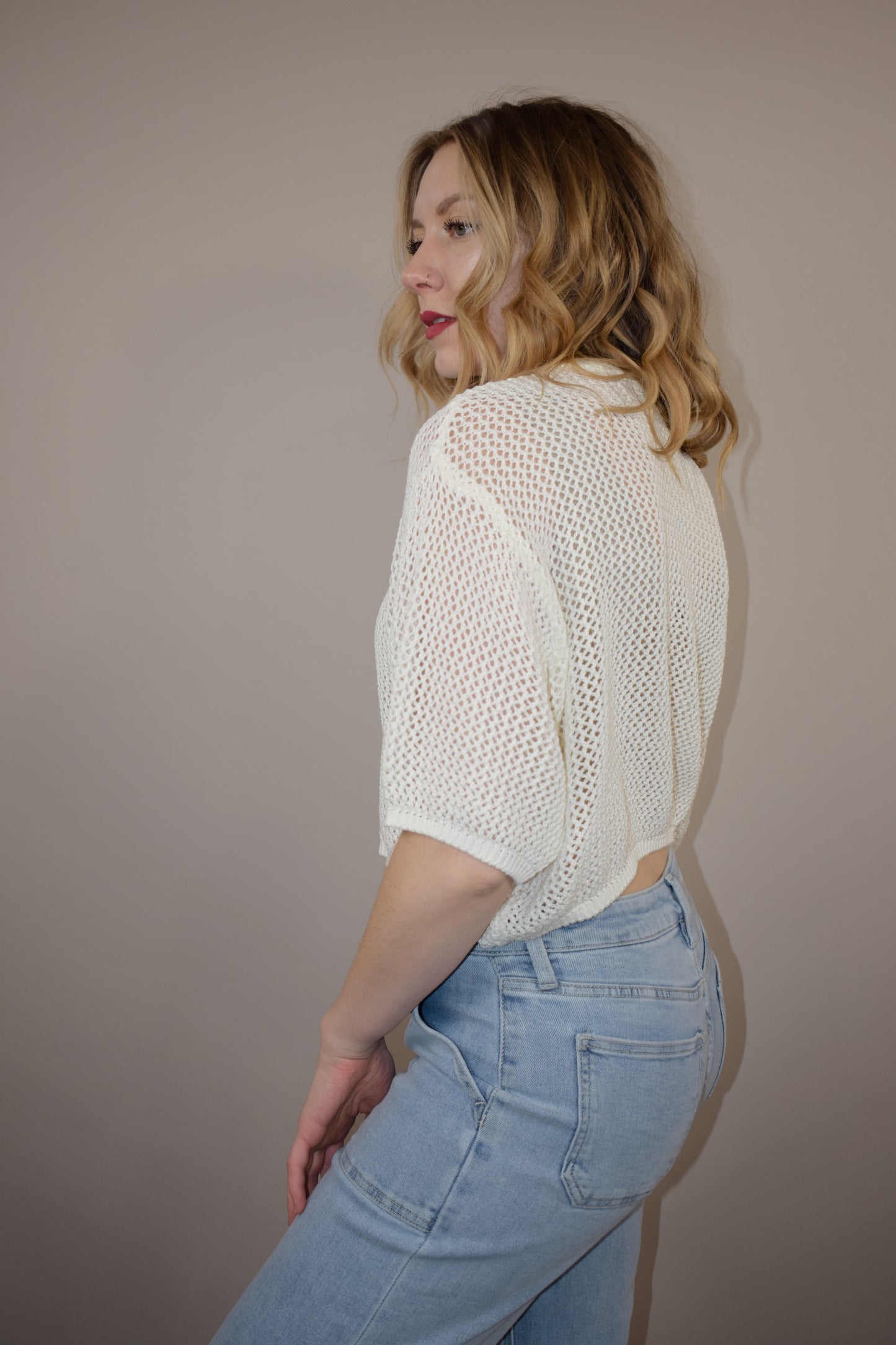 breezy cropped drop shoulder longer short sleeve crocheted shirt with buttons down the front and a crew neck style loose fitting perfect for warm weather