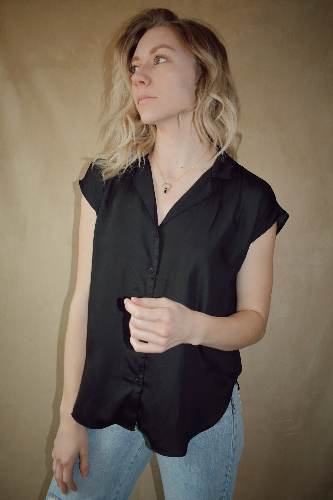 Light weight black button down scooped hemline full length blouse with collar and cap sleeves. Brand is Miou Muse. 