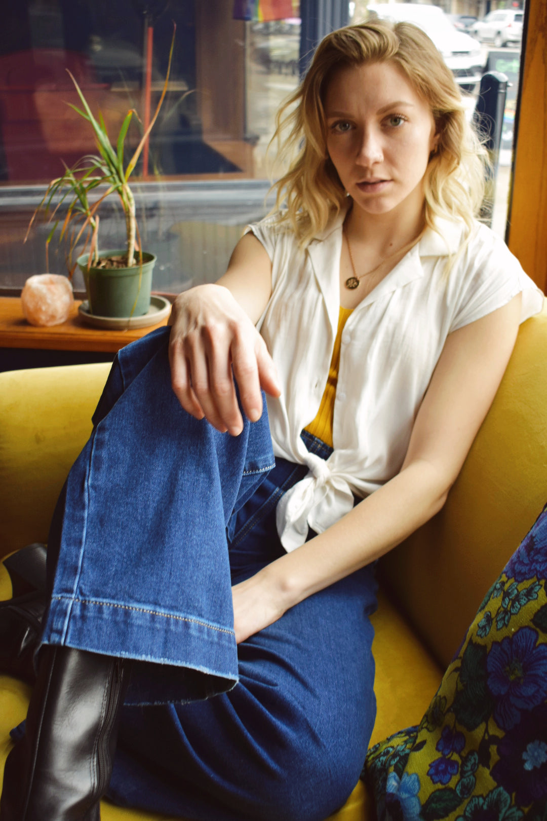 Q2. Relaxed high waist silhouette jeans with wide leg and straight fit. Gold sailor buttons on either side in the front. Dark blue. No holes no distressed wash. Made in Italy. 